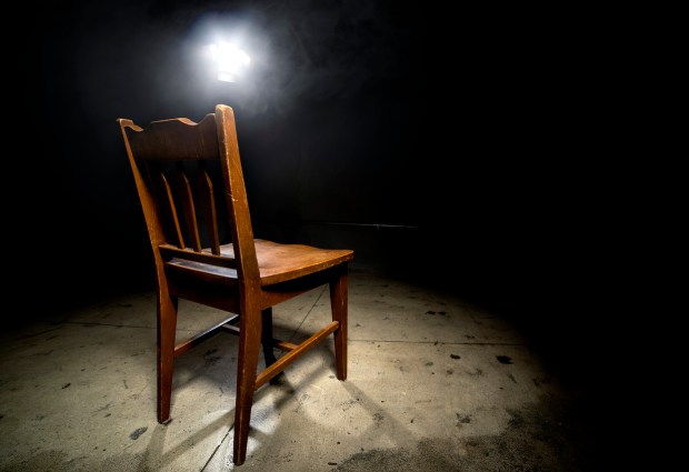 Empty Chair in an Interrogation Room